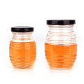 Wholesale 100ml 180ml 380ml 730ml threaded bee shape honey glass jar containers with screw lid